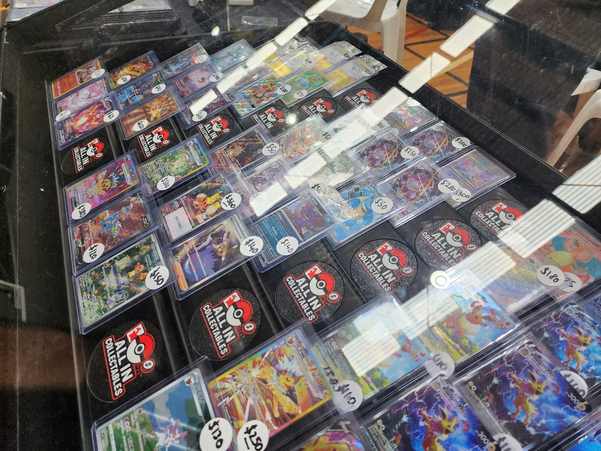 Risr risers displaying toploader cards, angled
